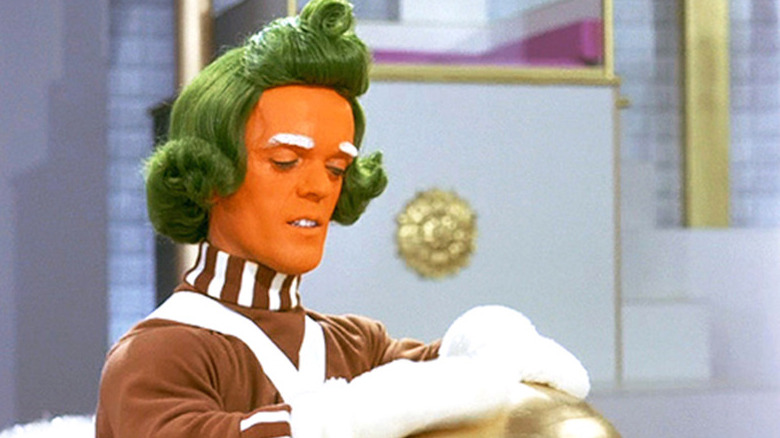 Oompa Loompa polishing golden egg