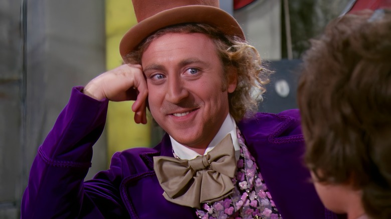 Willy Wonka head on hand smiling