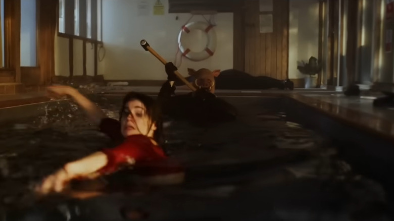 Piglet chasing a woman in the pool in Blood and Honey