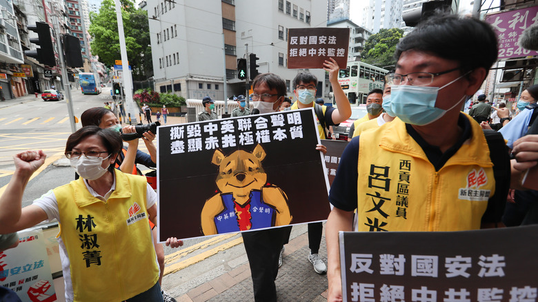 Protesters in Hong Kong hold up photos of Winnie the Pooh