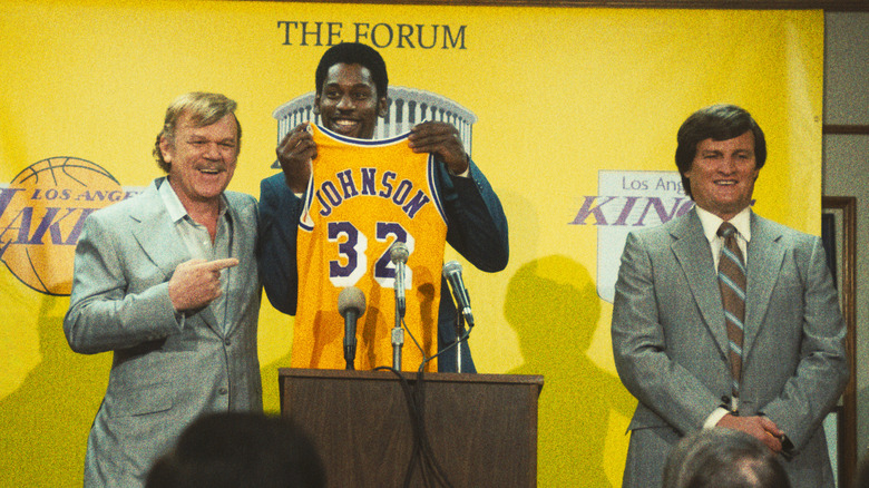 John C. Reilly, Quincy Isaiah and Jason Clarke at the podium in "Winning Time"