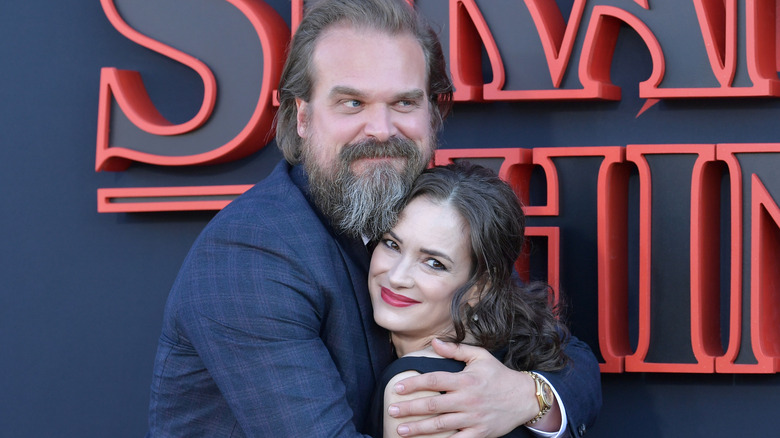 David Harbour hugging Winona Ryder