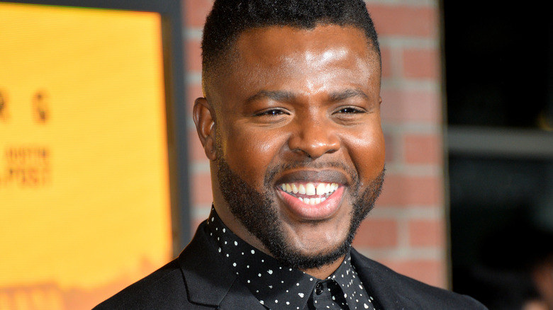 Winston Duke smiling about being king