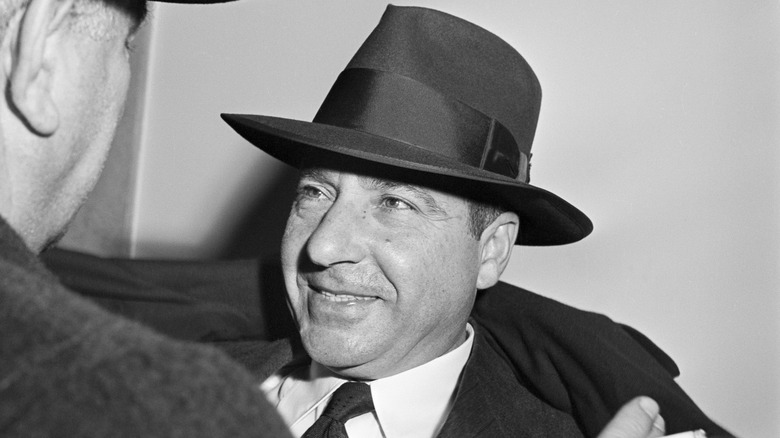 Frank Costello wearing black hat