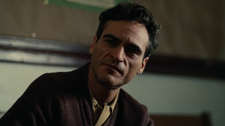 Joaquin Phoenix sitting in The Master