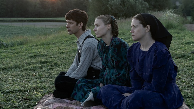 Whishaw, Mara, Foy sitting on blanket