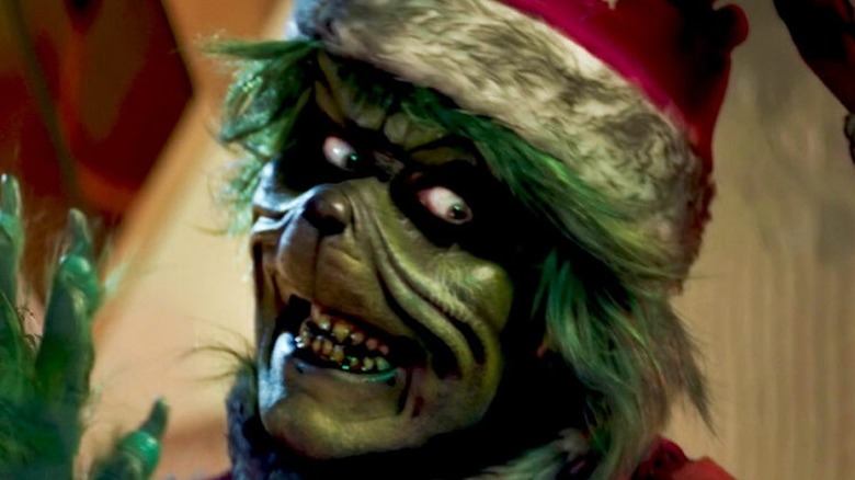 Evil Grinch smiles cruelly