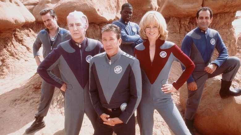 The cast of Galaxy Quest posing on an alien planet