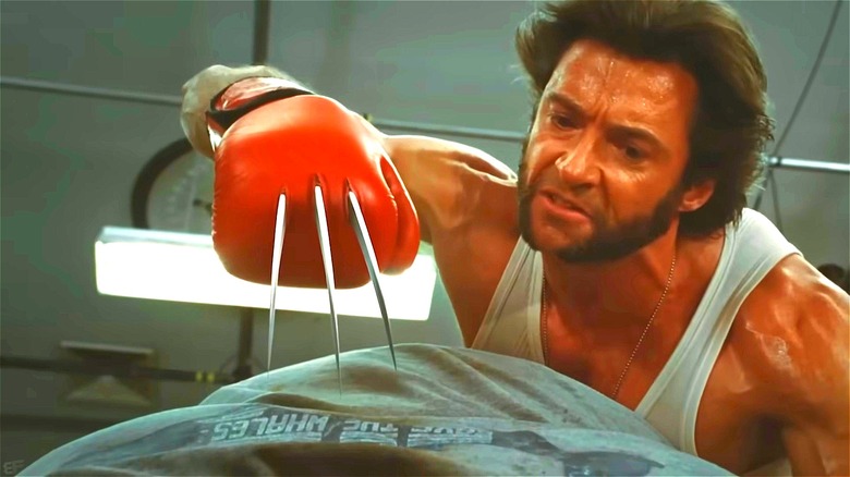 Wolverine pointing claws down at Blob