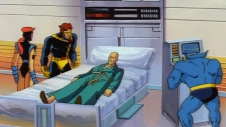 Xavier in coma with Cyclops, Beast, and Jean