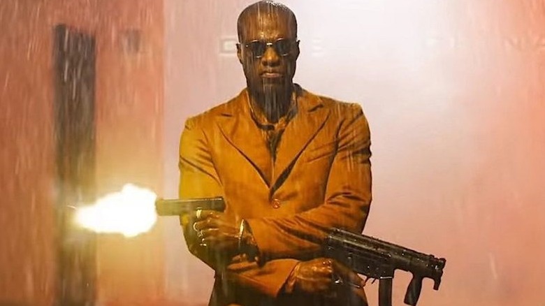 Morpheus holding two guns