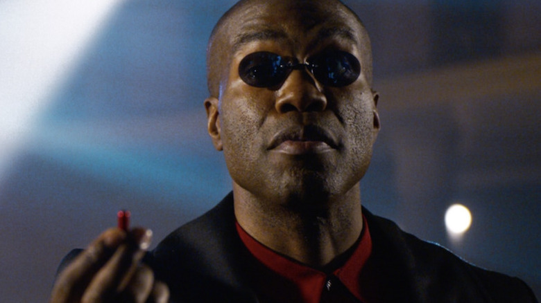 Morpheus holding red pill