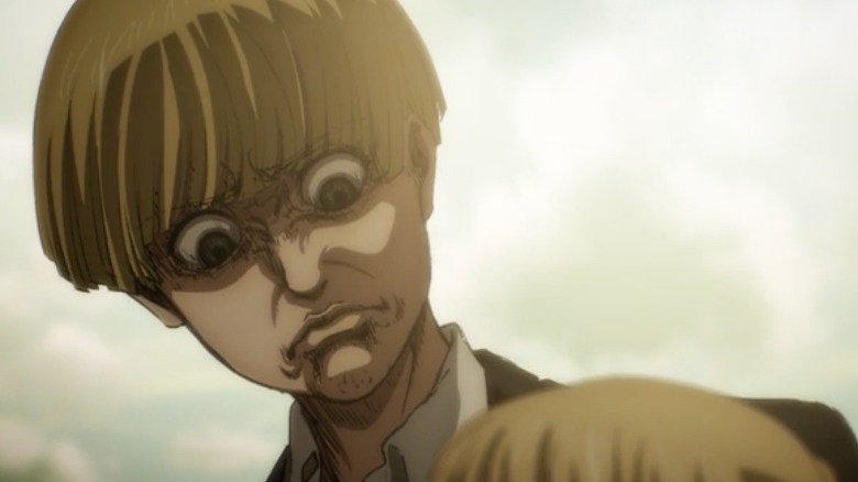 Yelena looking intense and standing over Armin