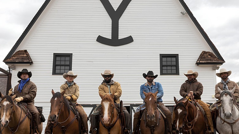 The ranch hands on horseback