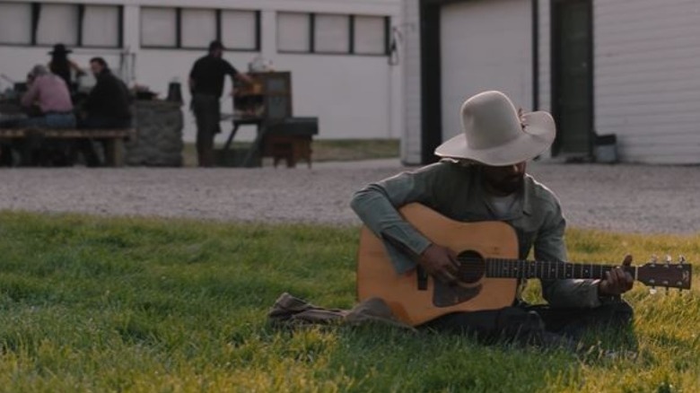 Ryan Bingham playing guitar in Yellowstone 