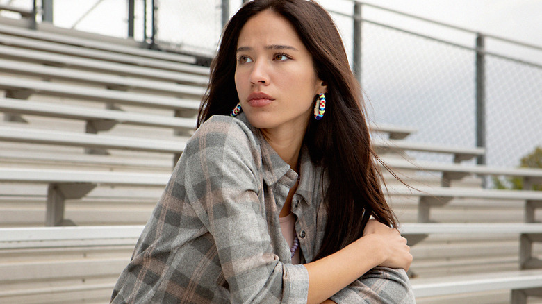 Monica sitting on bleachers