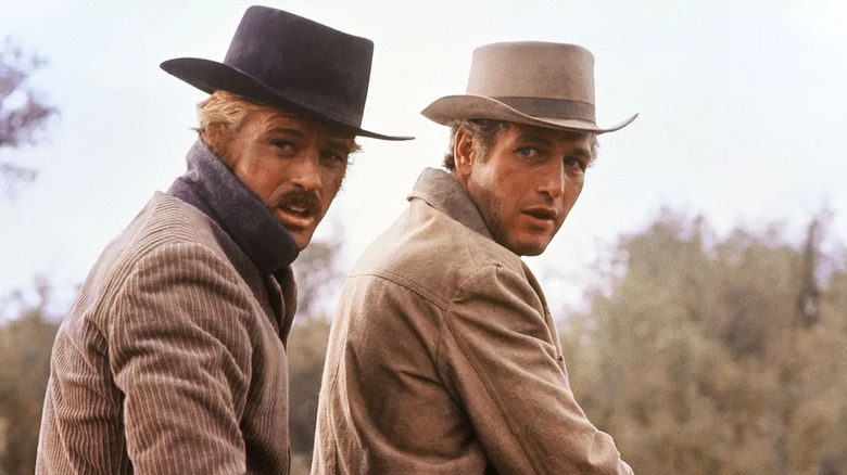 Butch Cassidy and the Sundance Kid looking concerned on horseback