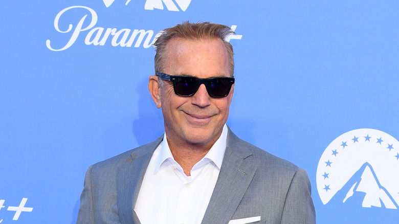 Costner at an event for Paramount plus with sunglasses on