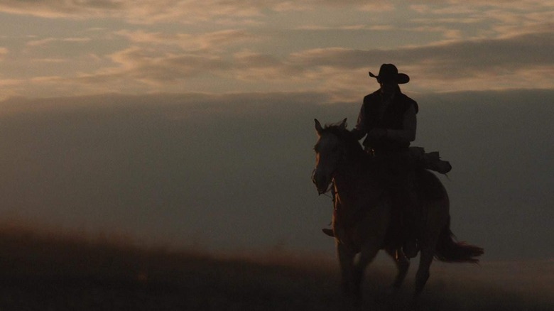 Kevin Costner with soaring Montana vista behind him