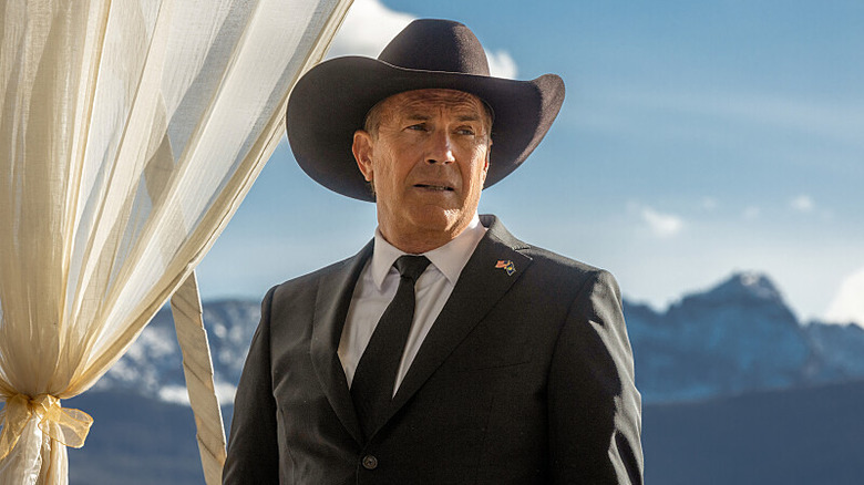 Kevin Costner as John Dutton in cowboy hat and suit in Yellowstone