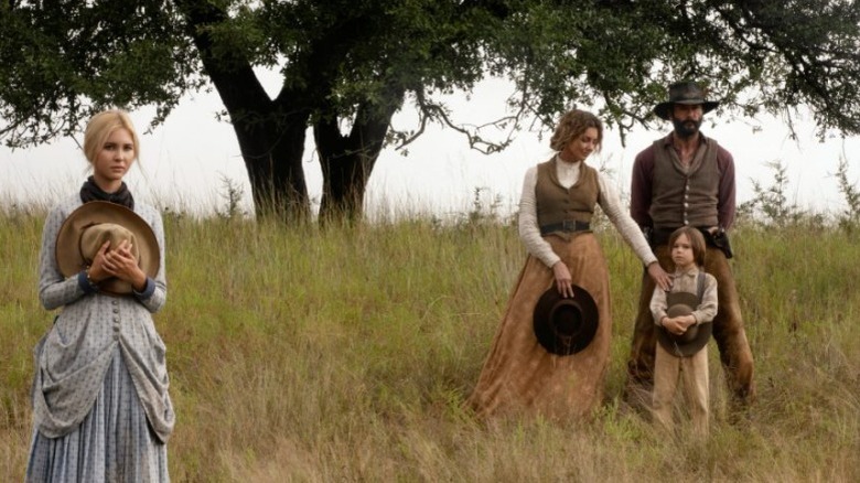 1883 Dutton family in a field