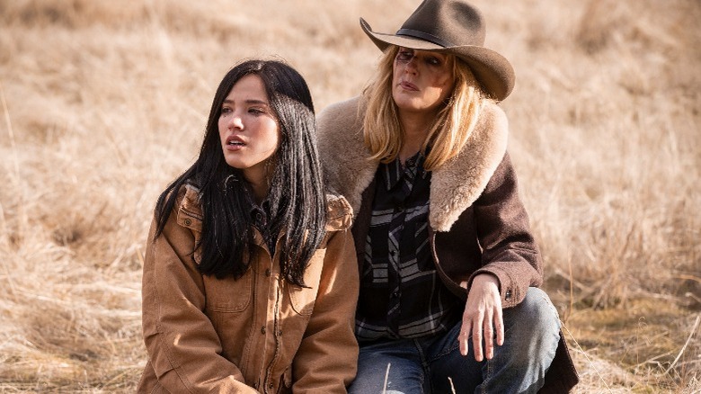 Monica and Beth kneeling in the brush