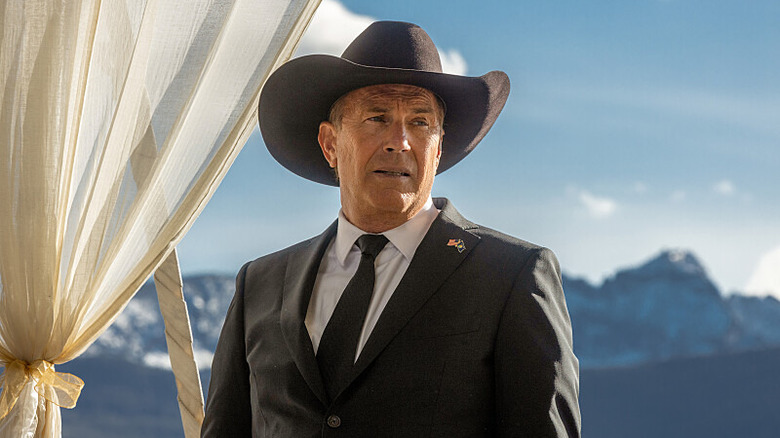Kevin Costner as John Dutton in Yellowstone wearing cowboy hat and suit