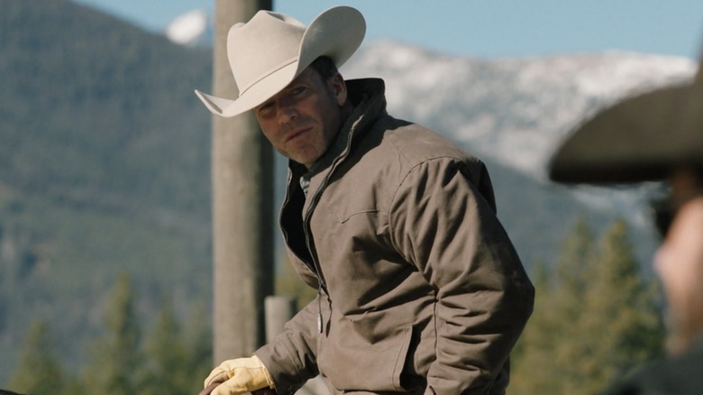 Travis Wheatley wearing white cowboy hat 