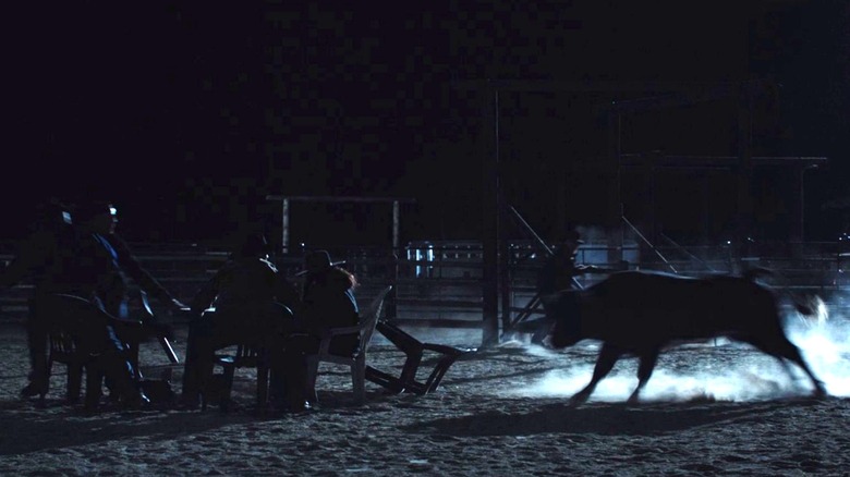 Bull charging at table