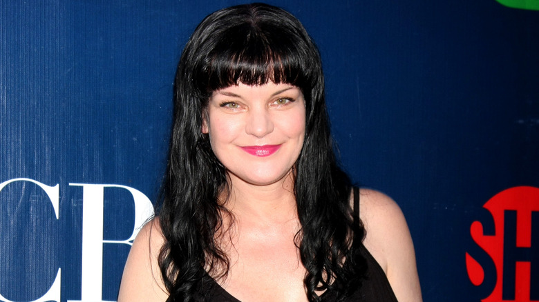 Pauley Perrette smiling at event