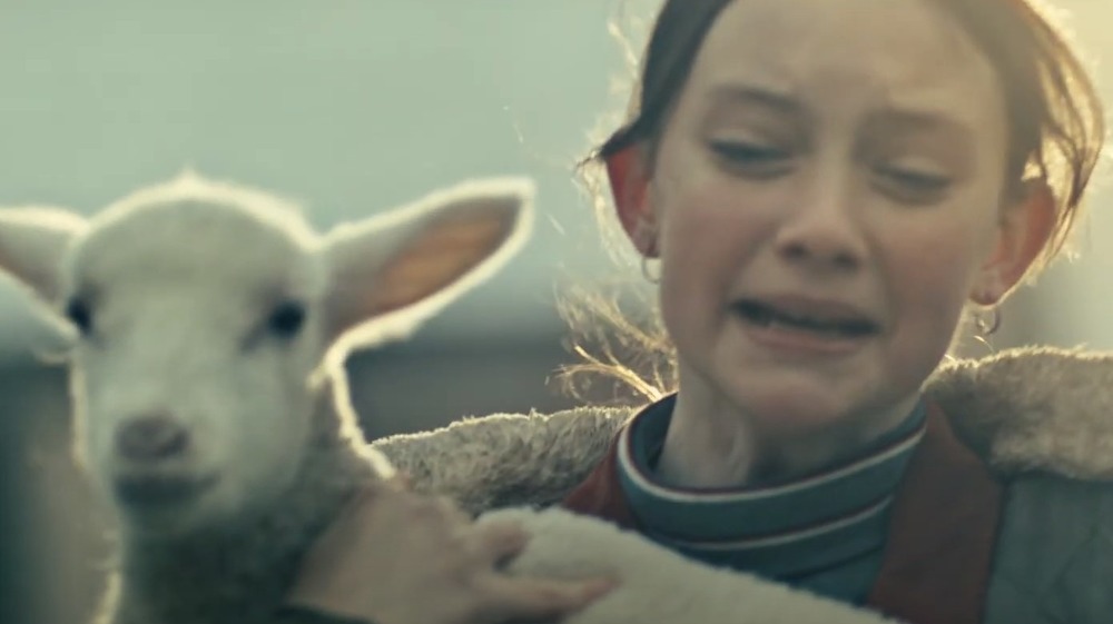 Young Clarice crying with a silenced lamb