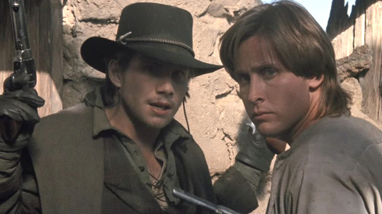 Christian Slater hands in the air in Young Guns 2