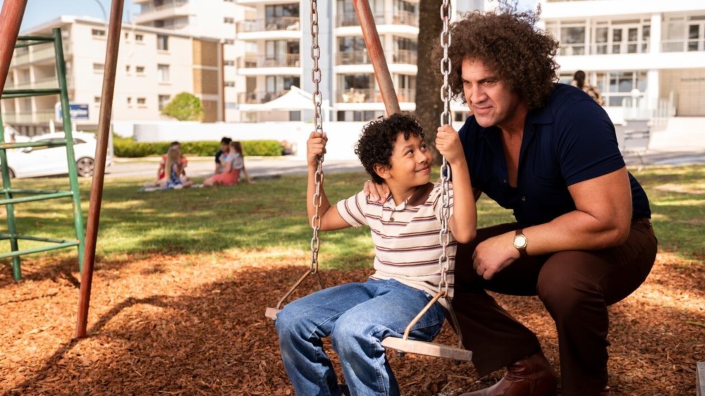 Andre pushes Dewey on swing