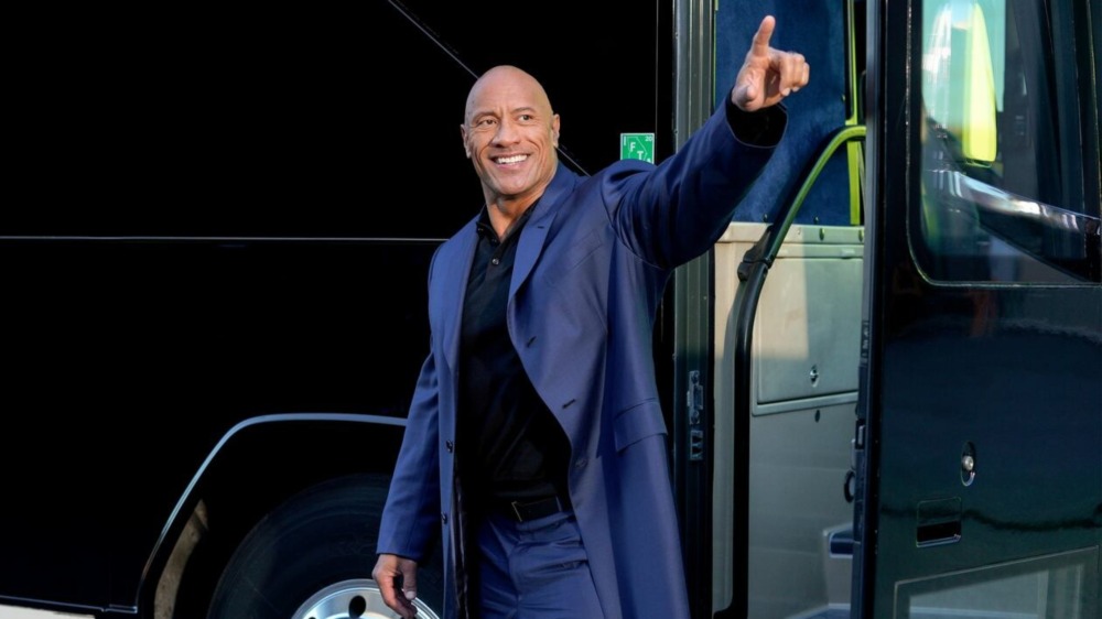 FINALLY THE ROCK IS ABOUT TO ENTER THE BUS