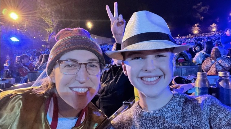 Mayim Bialik and Iain Armitage smiling into the camera