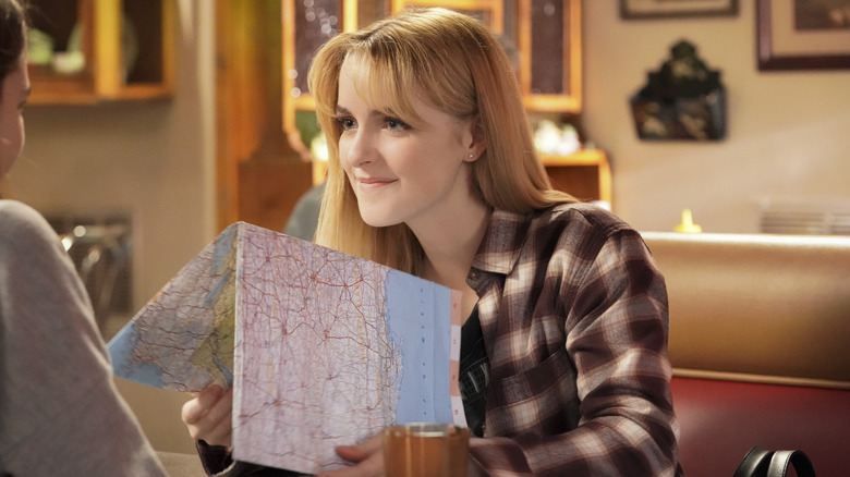 Paige holding map