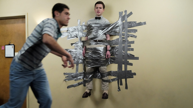 Sheldon taped to the wall