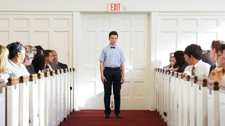 Young Sheldon walking in church