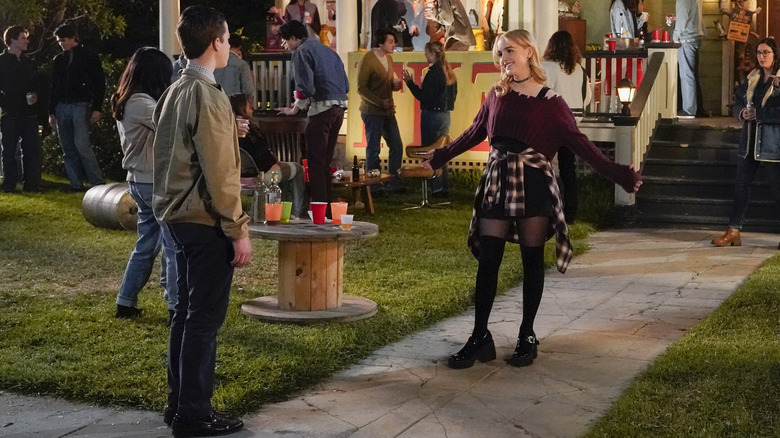 Sheldon and Paige outside a frat party