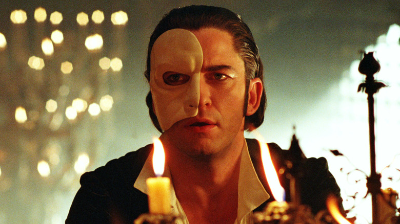 The Phantom looks over candles