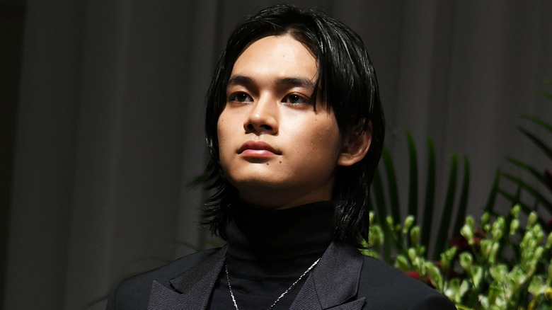 Takumi Kitamura wearing black suit