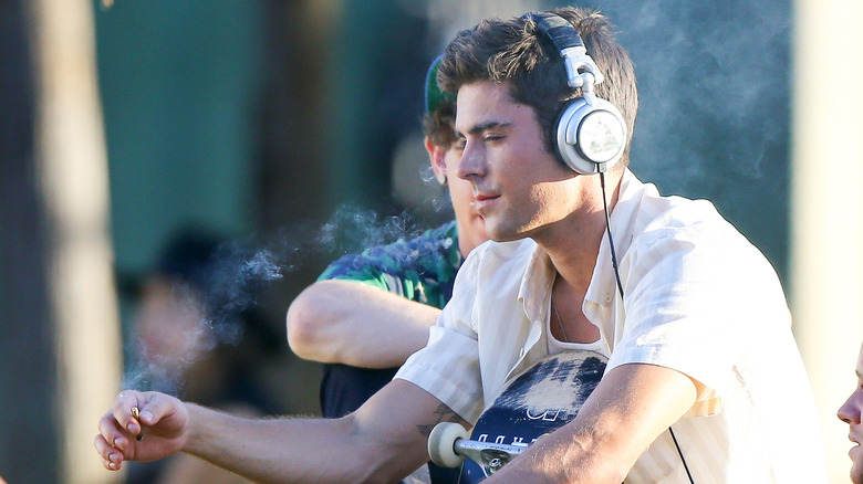 Zac Efron smoking on set