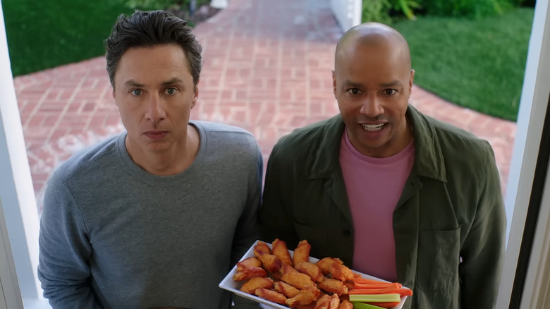 Zach Braff standing with Donald Faison