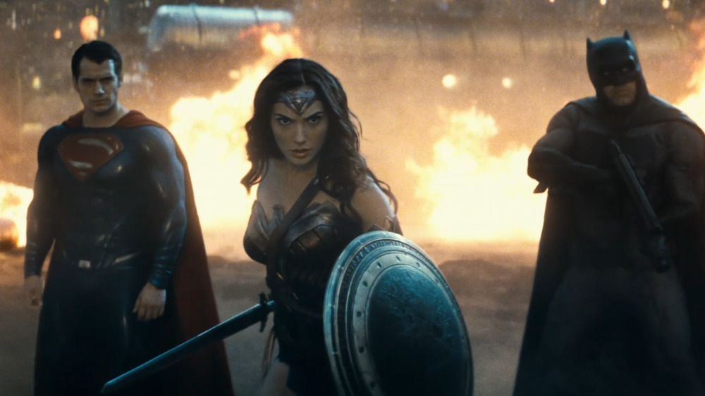 Superman, Wonder Woman and Batman preparing for battle