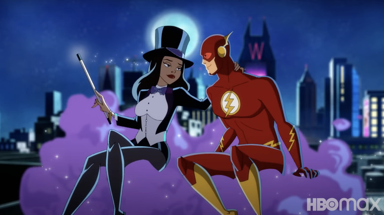 Zatanna and The Flash riding on a pink, sparkly cloud over Gotham City