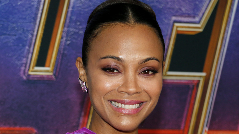 Zoe Saldana smiling at an event