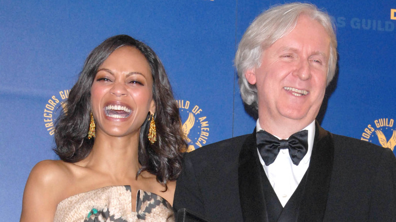 Zoe Saldaña and James Cameron smile