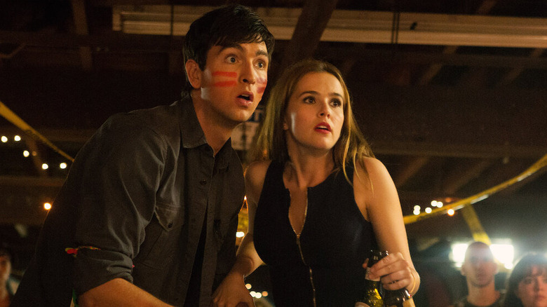 Nicholas Braun and Zoey Deutch at a party in "Good Kids"