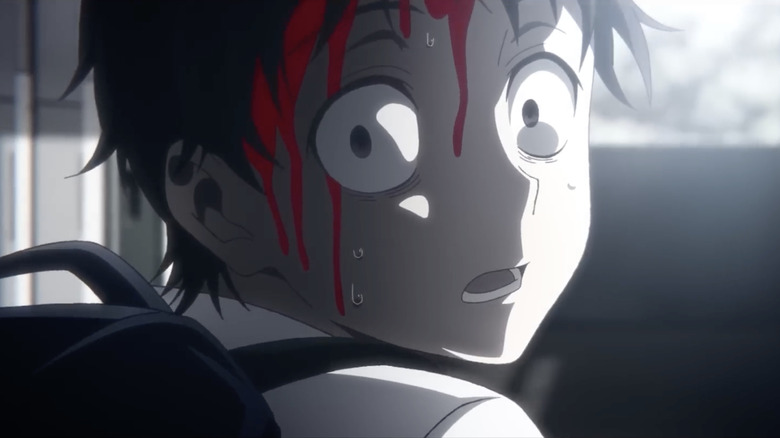 Akira Tendo with blood on forehead