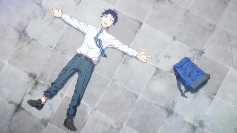 Akira Tendo lying on roof